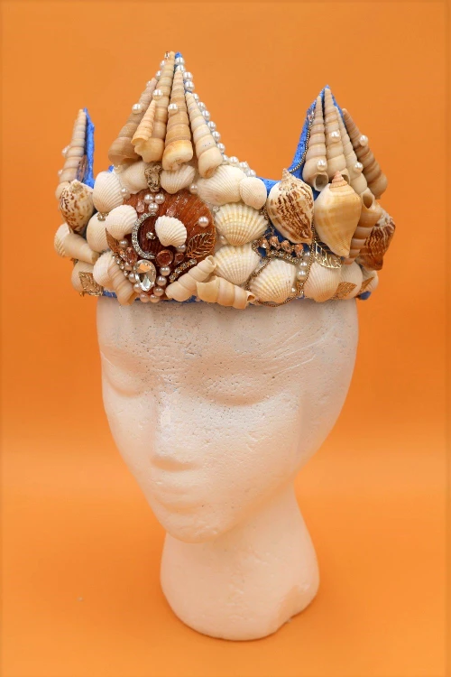 Learn how to make a beautiful DIY mermaid crown with real seashells! This project is also a great way to use up old jewelry!